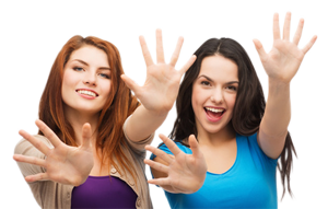 two smiling girls showing their palms